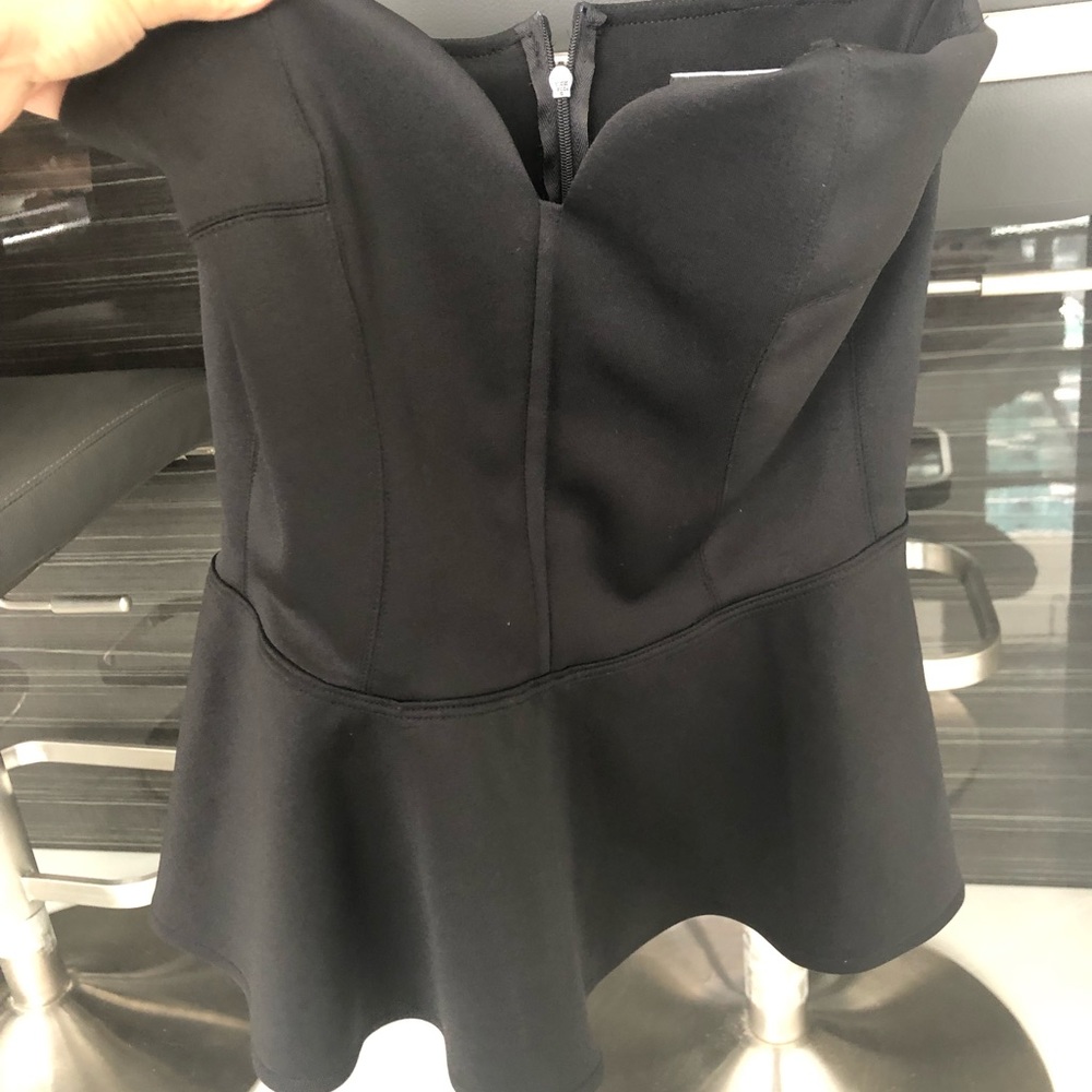 Strapless black flare top